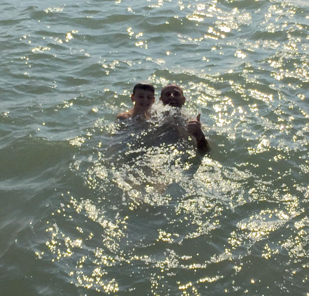 Neil and Zack swimming